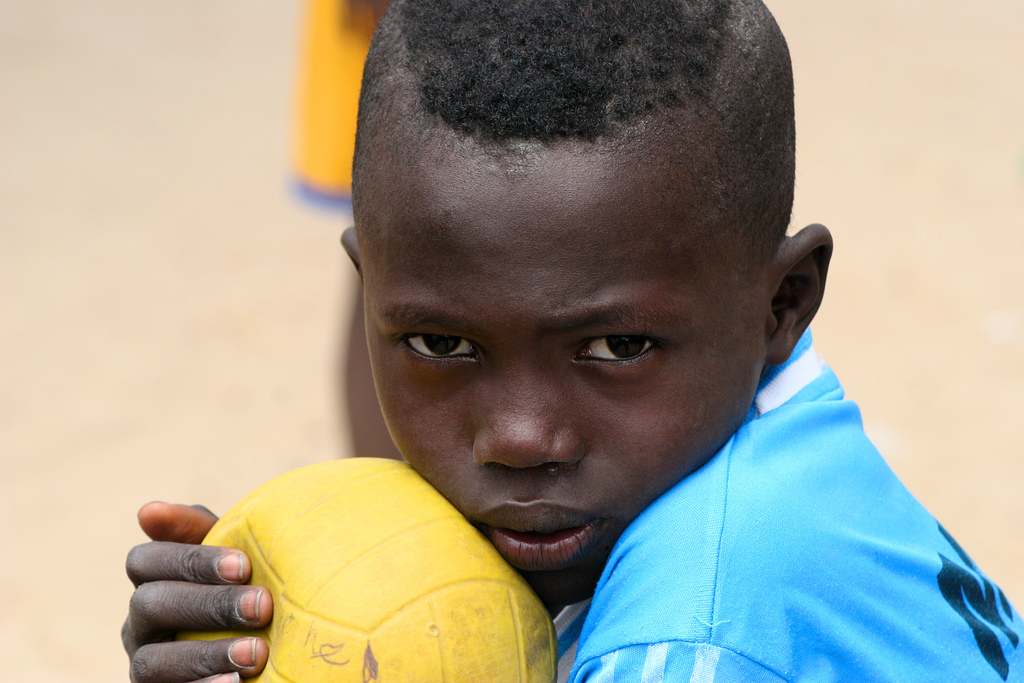 portrait-boy-soccer-ball Dreaming of becoming a soccer star in Dakar, Senegal.