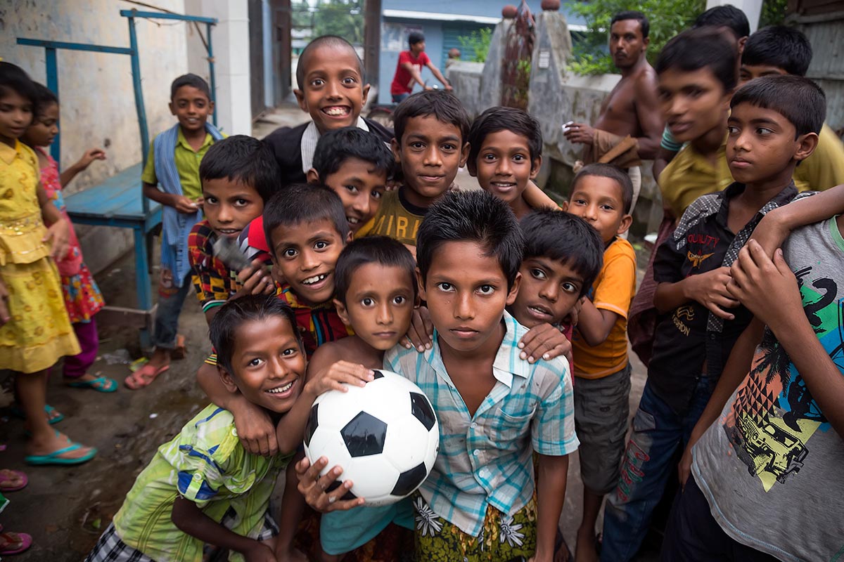 Kids playing football in the streets of Galachipa in Bangladesh.