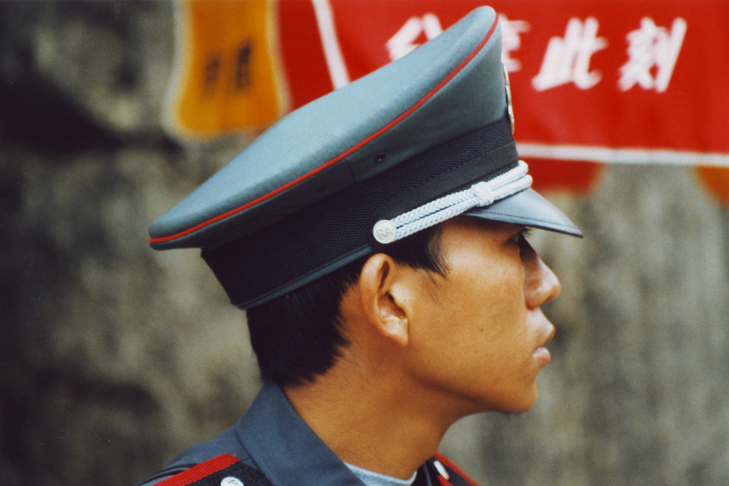 An officer in front of the Lost City in Beijing.