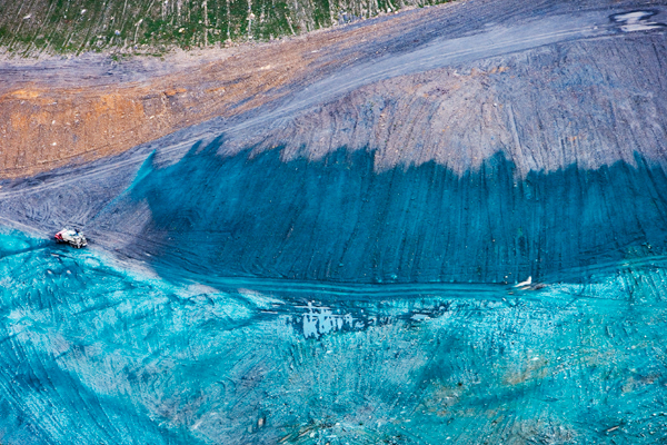 The forested mountains, valleys and streams that once stood here are now buried beneath the overburden from mountaintop removal coal mining. It is leveled and then sprayed with a mixture of grass seed and fertilizer - Kayford Mountain, West Virginia.