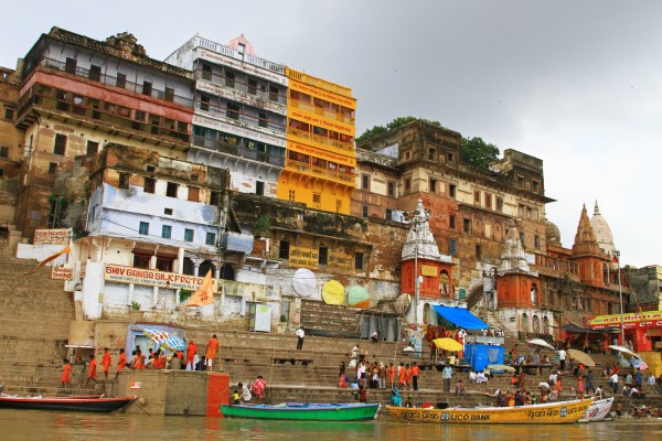 boat-ride-ganges-river-ghats-varanasi-india The view from a boat floating along the Ganges river in Varanasi, India.