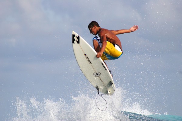 surfer-escaping-wave-teahupoo-tahiti Escaping the waves.
