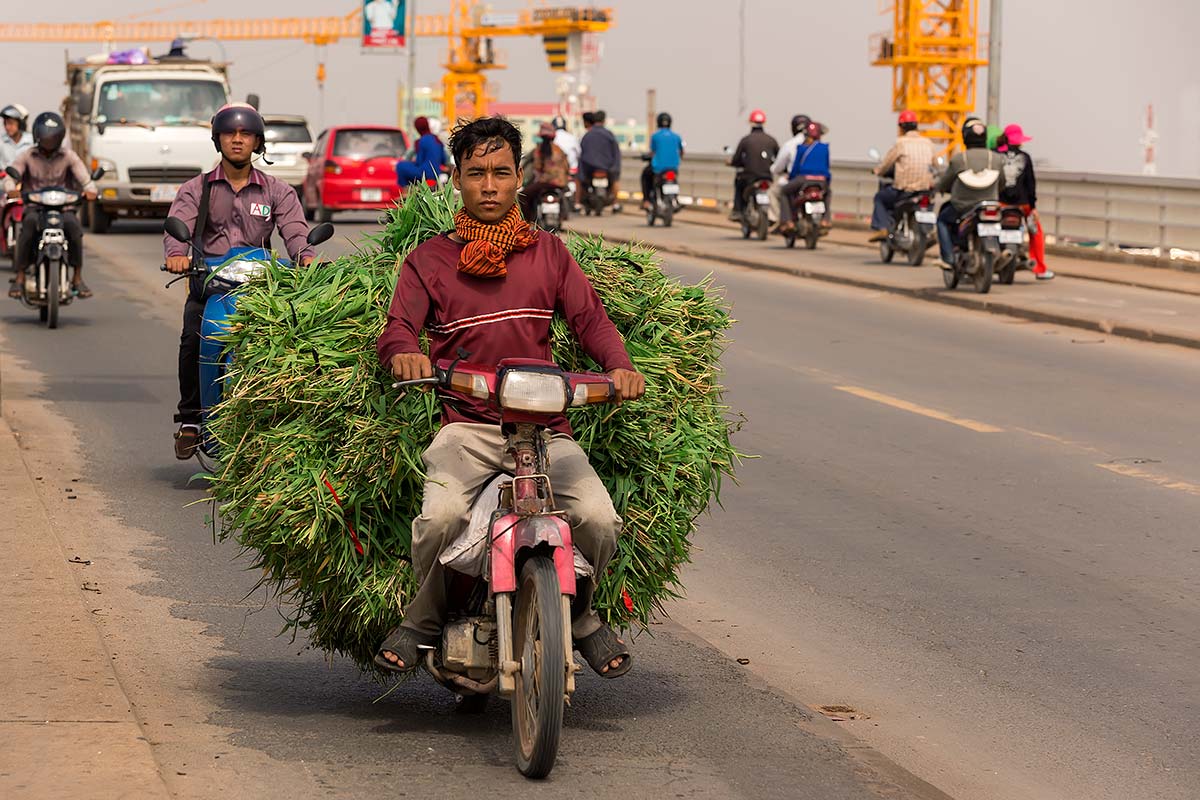 Day in day out, thousands of motorbikes, cars, trucks and walkers cross the bridge out of Phnom Penh.