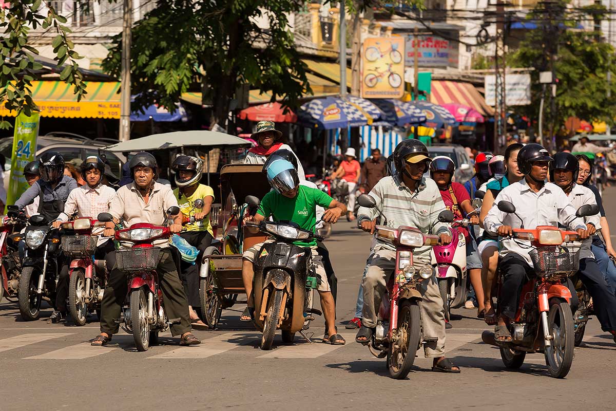 phnom-penh-motorbike-traffic-cambodia It seems like there are as many motorbikes in Phnom Penh as people who live there.