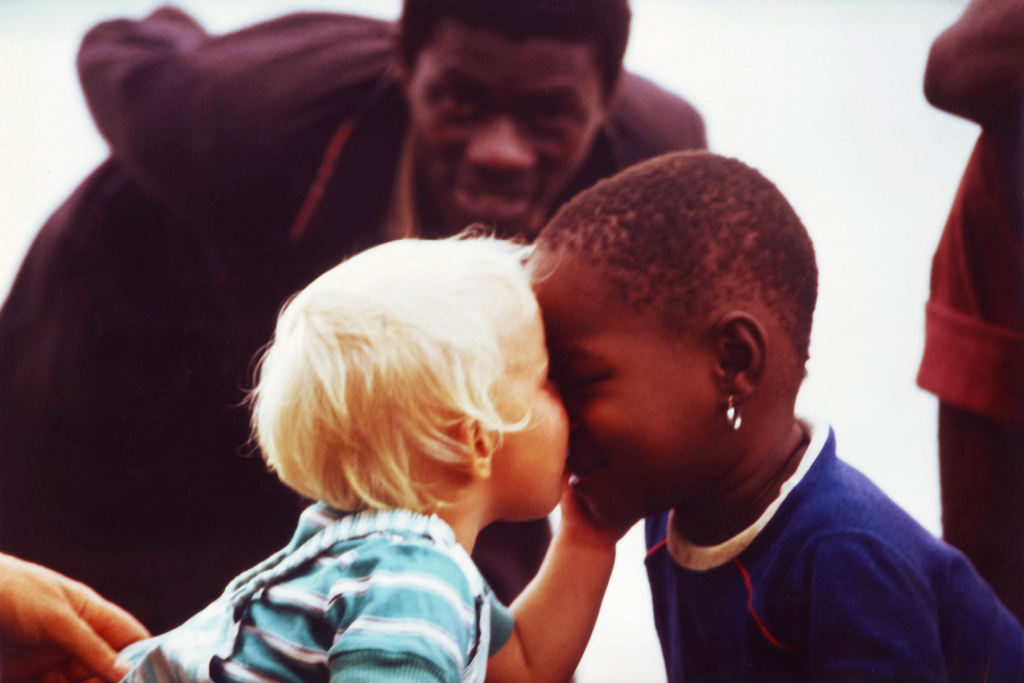 Black & white kids kissing in the Sudan - this is our most viewd picture...