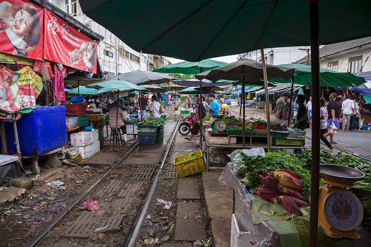 Even if you’ve never heard Mahachai market, you’ve probably seen a video of a train going through a tightly packed market, where market stalls are set up on the rails.