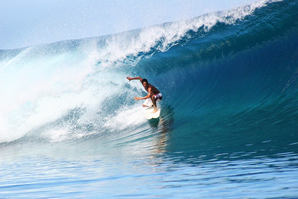 Perfect wave riding at Teahupoo, Tahiti.