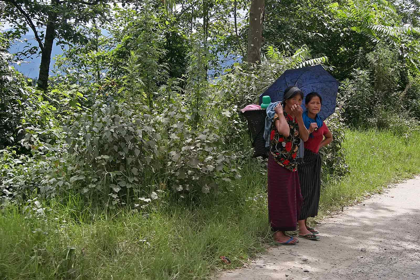 Women waiting for customers on the side of the road.