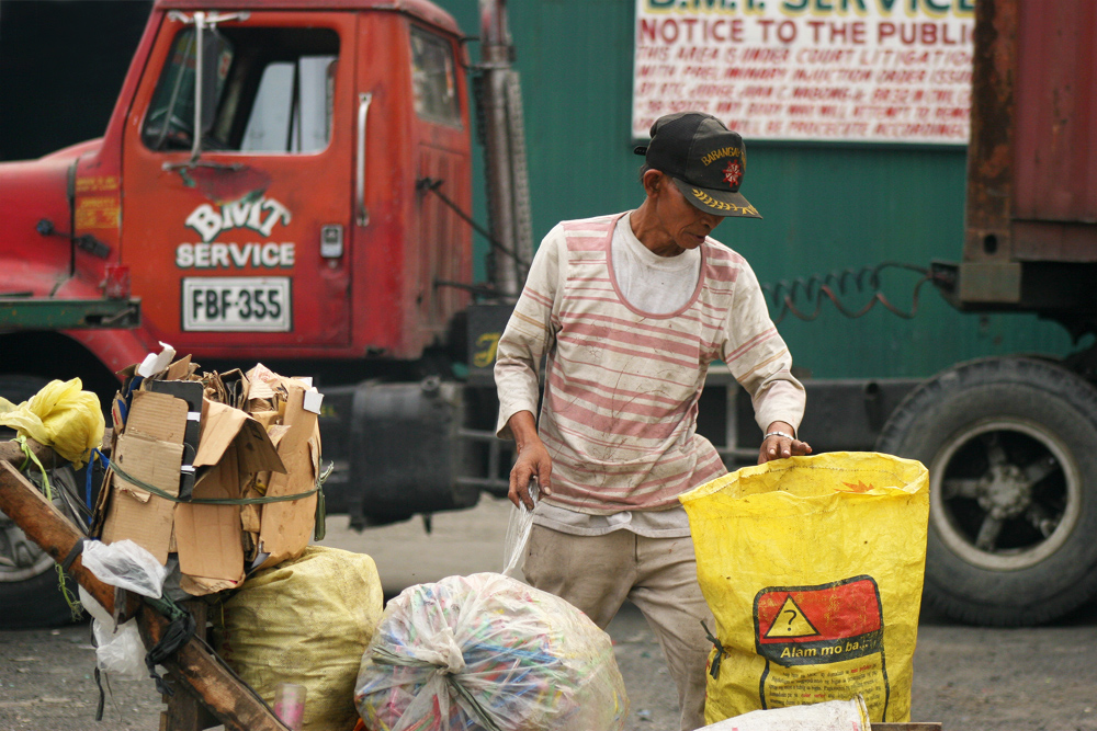 Collection the garbage around "Smokey Mountain". 