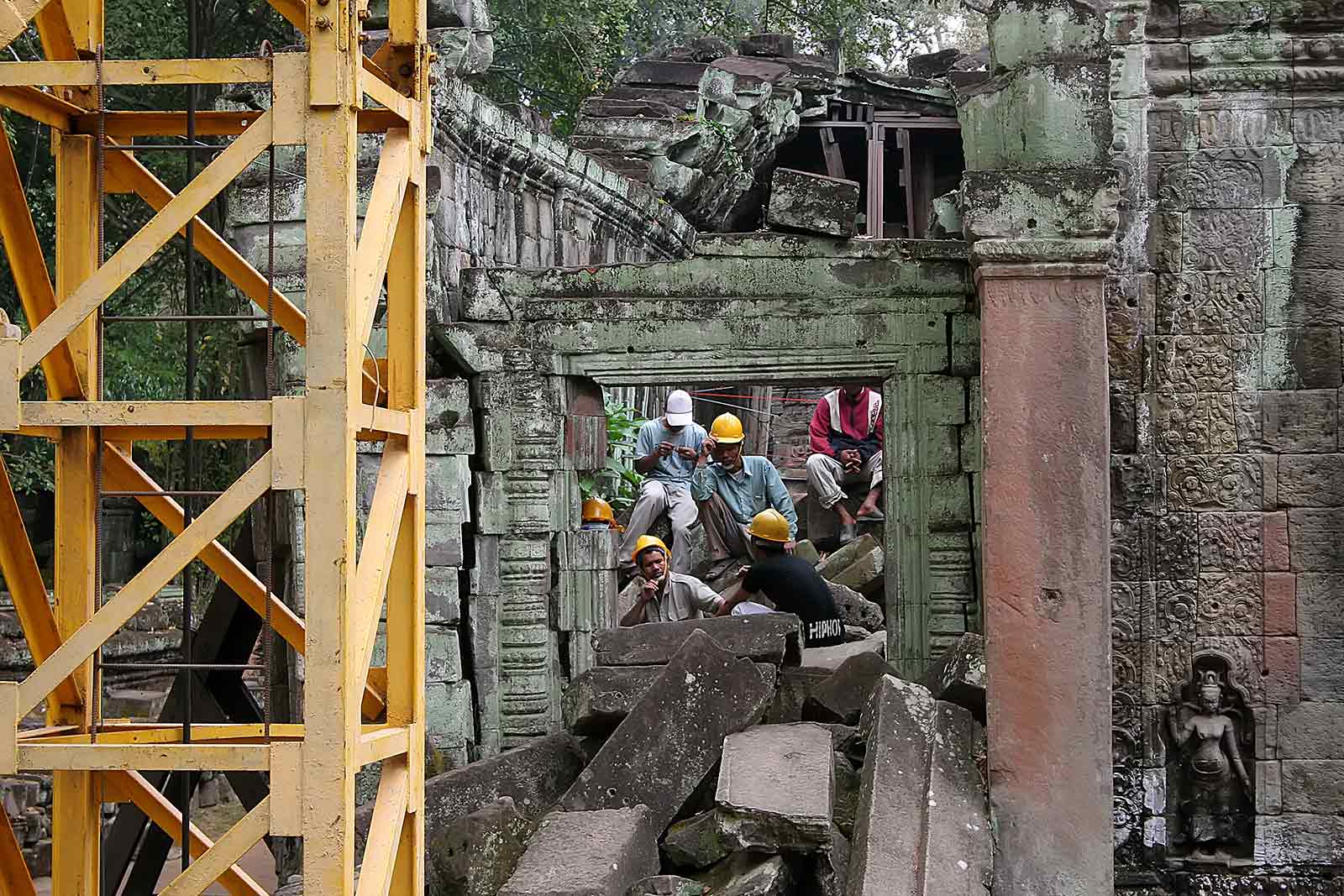 Workers try to keep Angkor Wat in a good stage.