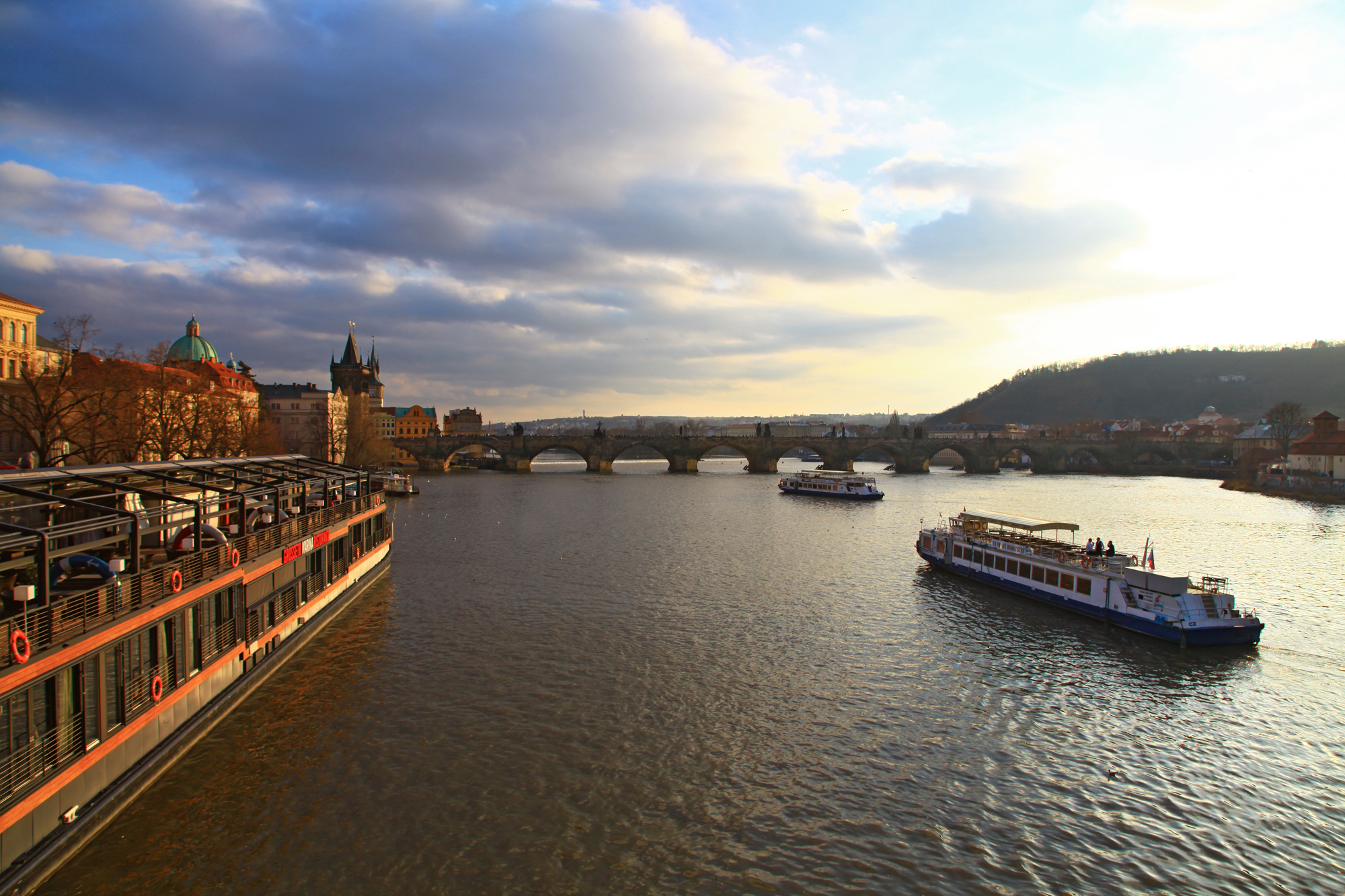 Charles Bridge is a famous historic bridge that crosses the Vltava river in Prague. The construction started in 1357 under the auspices of King Charles IV, and finished in the beginning of the 15th century.