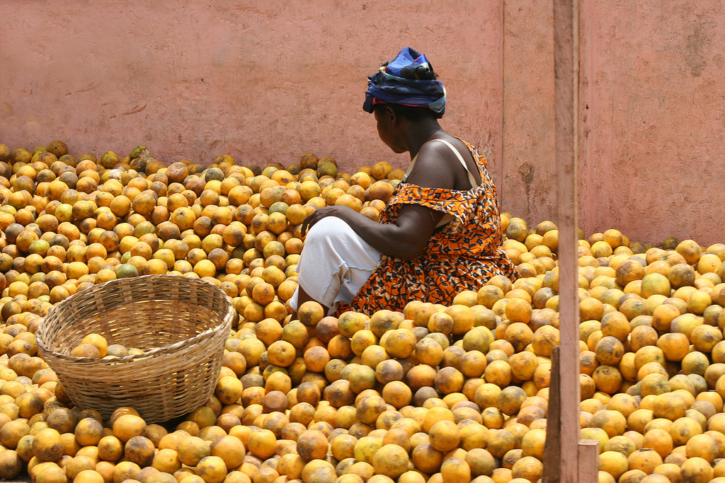 A market woman selling oranges in Accra, Ghana.