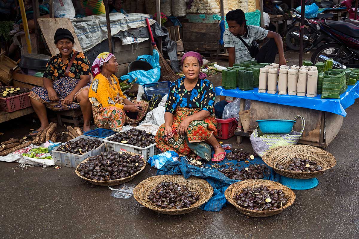 Striking evidence of the earthquake remains in the city of Padang in spots like Pasar Raya, the central market, a massive hulk of collapsed concrete around which vendors have set up hundreds of makeshift shops.