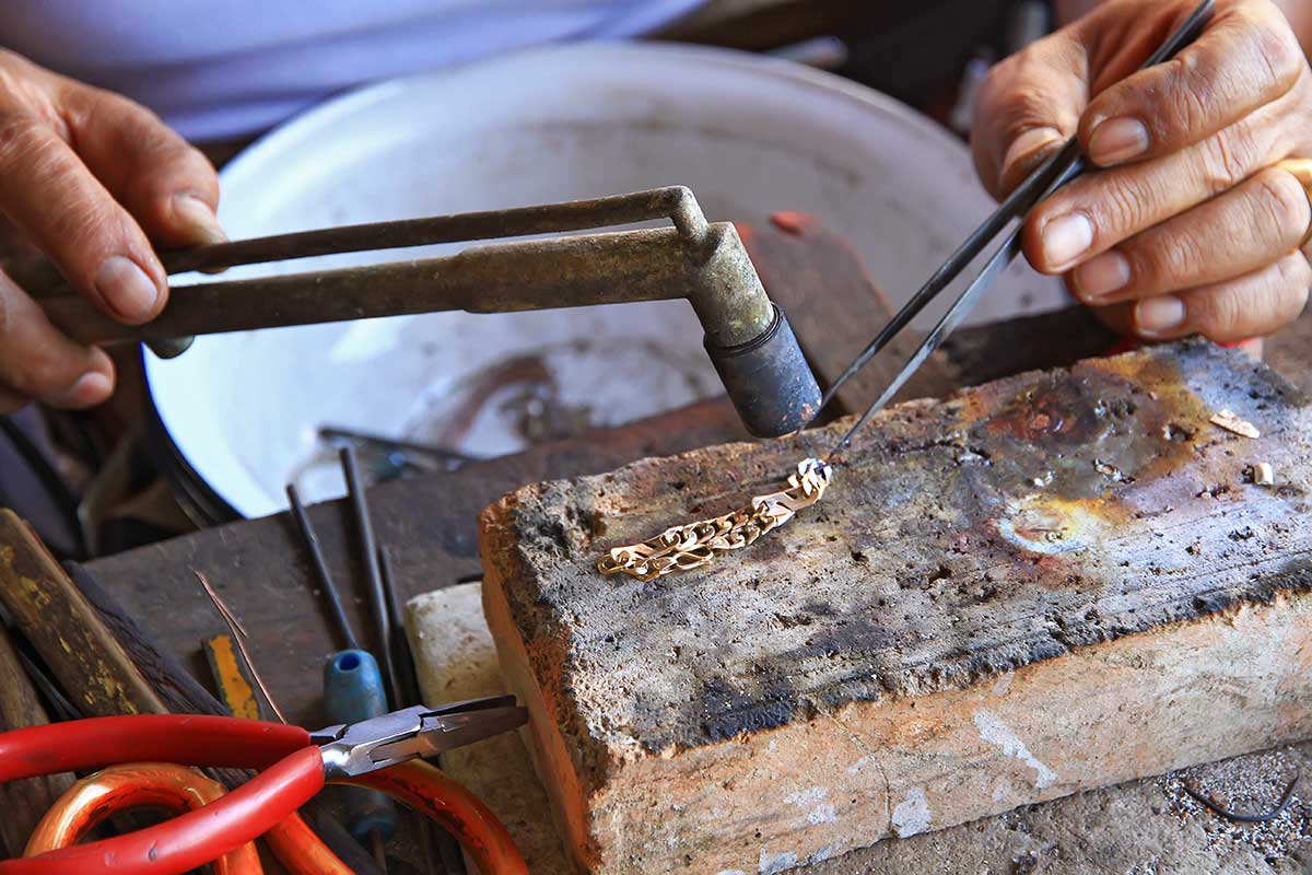 gold-maker-vientiane-laos Goldsmiths can be found at the market in Vientiane just behind the American Embassy.