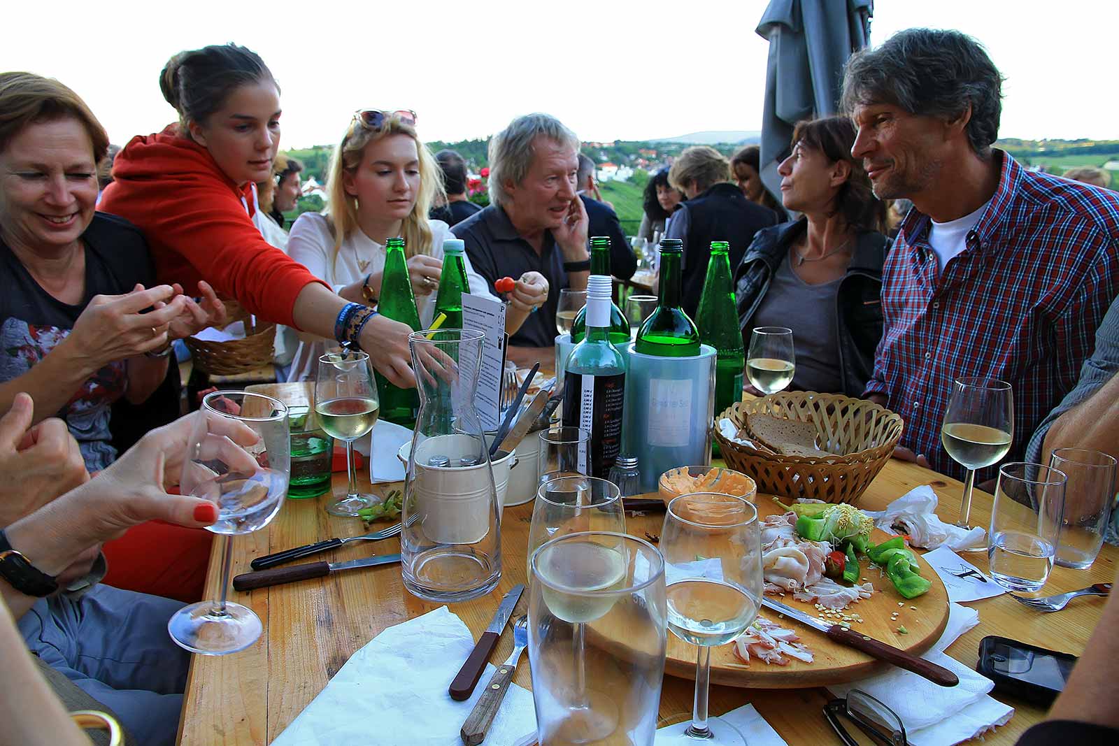 A typical Heurigen get together. The name was given to Eastern-Austrian wine taverns in which wine-growers serve the most recent year's wines.