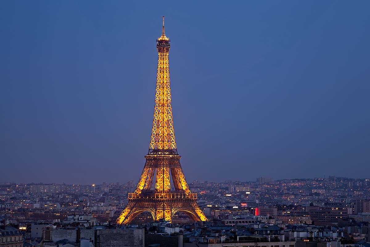 eiffel-tower-night-paris-france Erected in 1889 as the entrance arch to the 1889 World's Fair, the Eiffel Tower was initially criticised by some of France's leading artists and intellectuals for its design, but has become both a global cultural icon of France and one of the most recognizable structures in the world.
