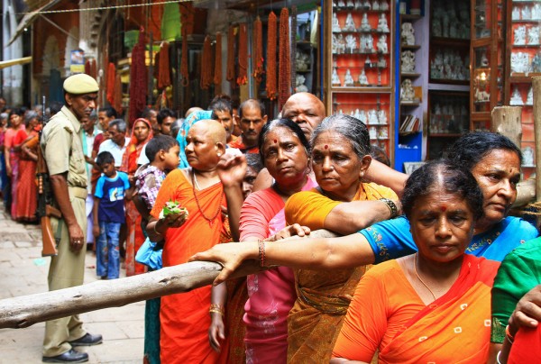 Krishna-festival-varanasi-india-crowds-of-people Waiting in line like cattle to enter a holy temple in Varanasi, India.