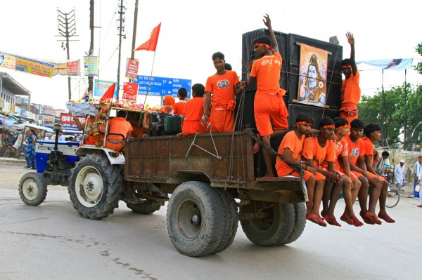 festival-varanasi-india-Krishna-people-on-truck Music is a must druing the festival in Varanasi, India.