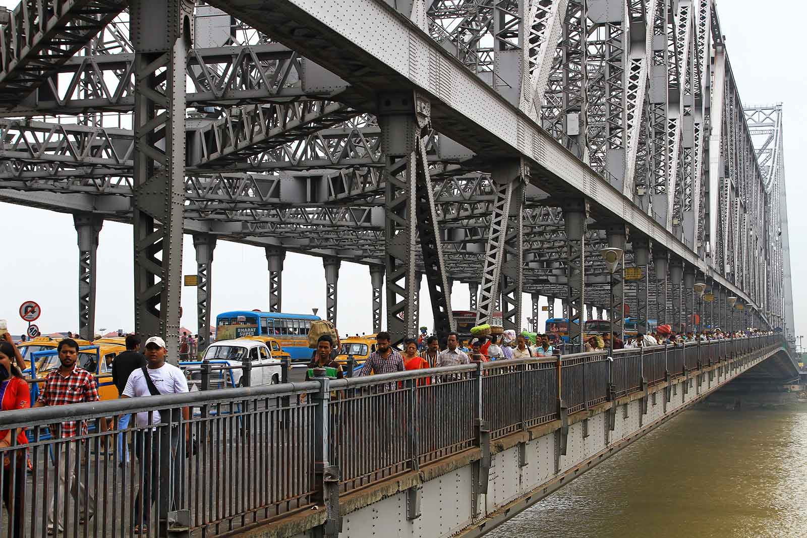 Crossing the Hoogly river on Howrah bridge in Kolkata, India.