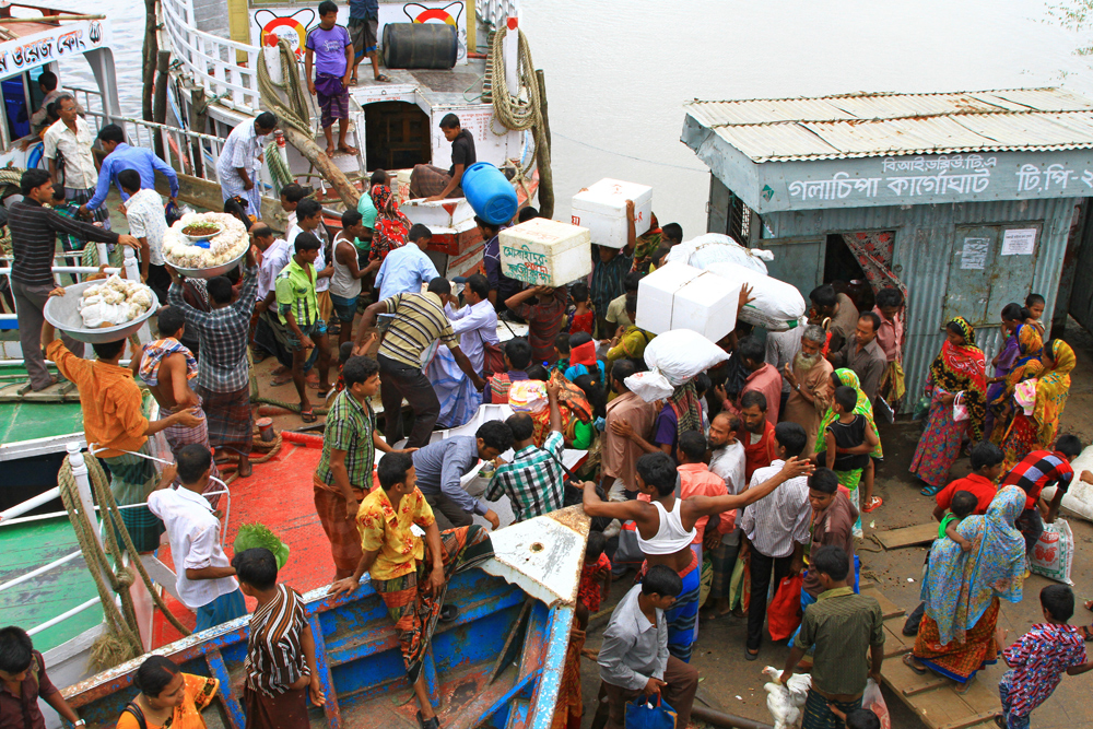 Loading a ferry at Galachipa port in Bangladesh.