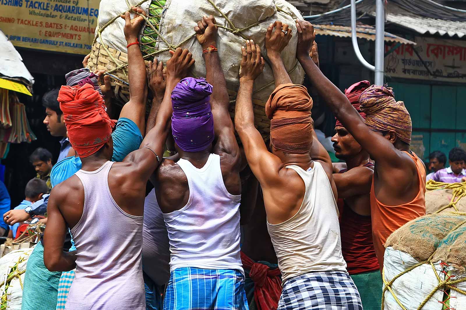 Pure manpower at the wholesale fruit market in Kolkata, India.