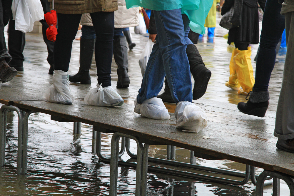 ... others try to save money by wrapping plastic bags around their shoes.