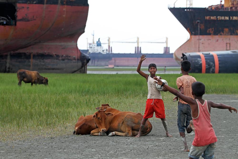 Kids playing in between the Ship Breaking Yard in Chittagong, Bangladesh.