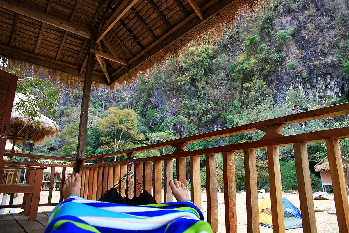 green-climbers-lodge-laos-hammock-Thakhek- Relaxing at the Green Climbers Home Lodge in Thakhek, Laos.