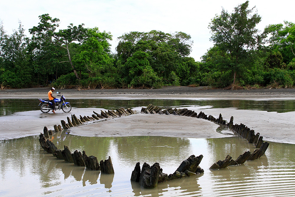 Antique boat washed up on Kuakata beach, Bangladesh.