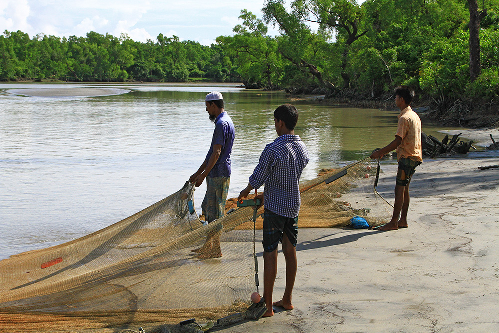 Fishermen at Kuakata beach, Bangladesh.