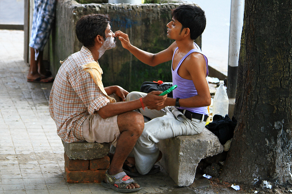 A barber shop on the street in Kolkata, India.