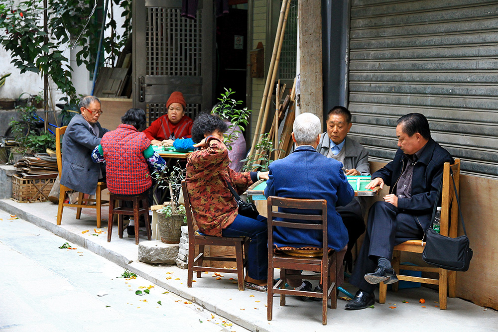 A group people playing Majong in Guangzhou, China.