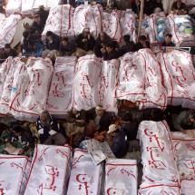 Associated Press/Arshad Butt - Pakistani Shiite Muslims sit in protest next to the dead bodies of their family members killed in Saturday's bombing Associated Press/Arshad Butt - Pakistani Shiite Muslims sit in protest next to the dead bodies of their family members killed in Saturday's bombing