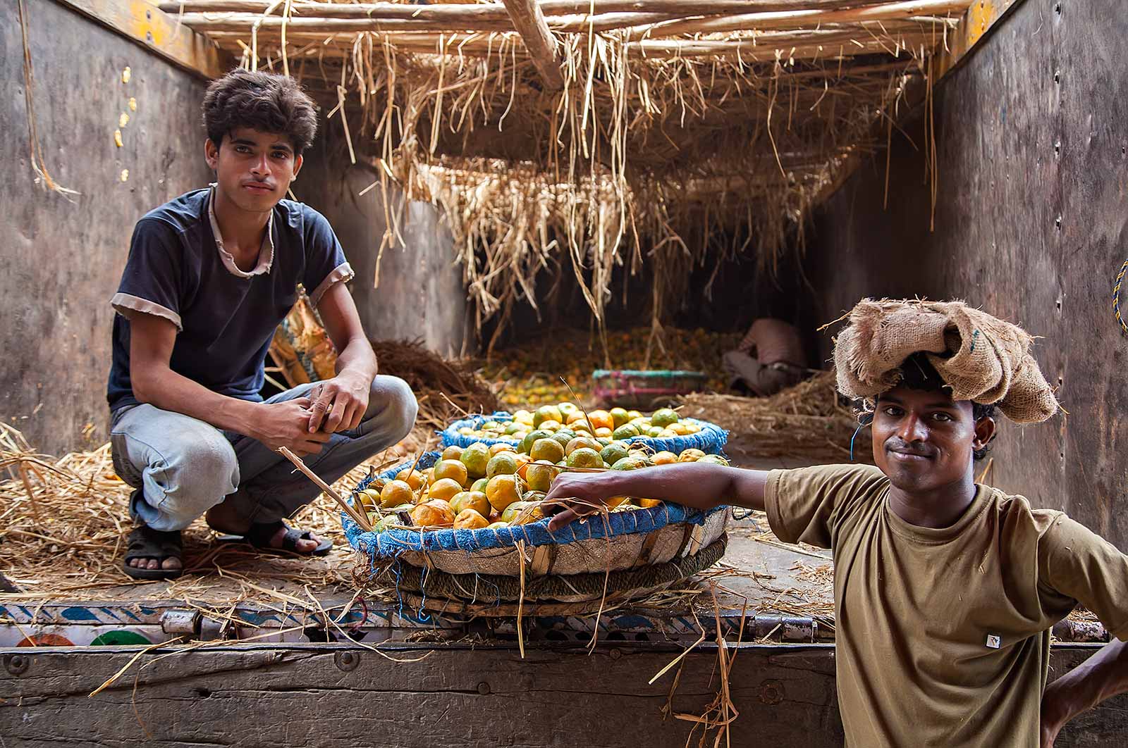 Working men at the the fruit wholesale market in Kolkata, India.