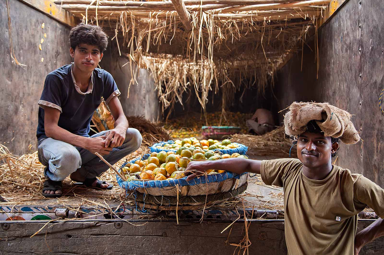 Working men at the the fruit wholesale market in Kolkata, India. Working men at the the fruit wholesale market in Kolkata, India.
