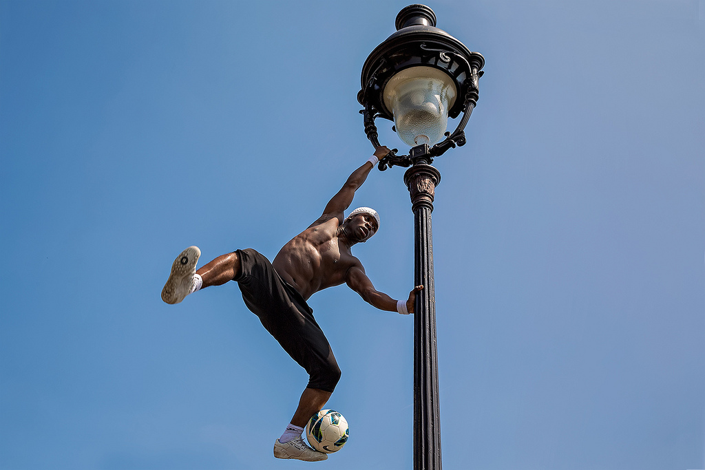 Freestyle footballer Iya Traoré at the Basilica of Sacré-Cœur in Paris, France.