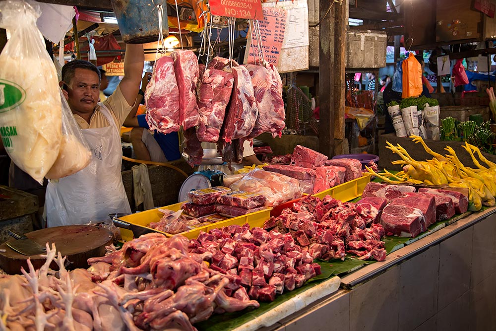 Walking through the meat section at Chow Kit market in Kuala Lumpur, Malaysia.