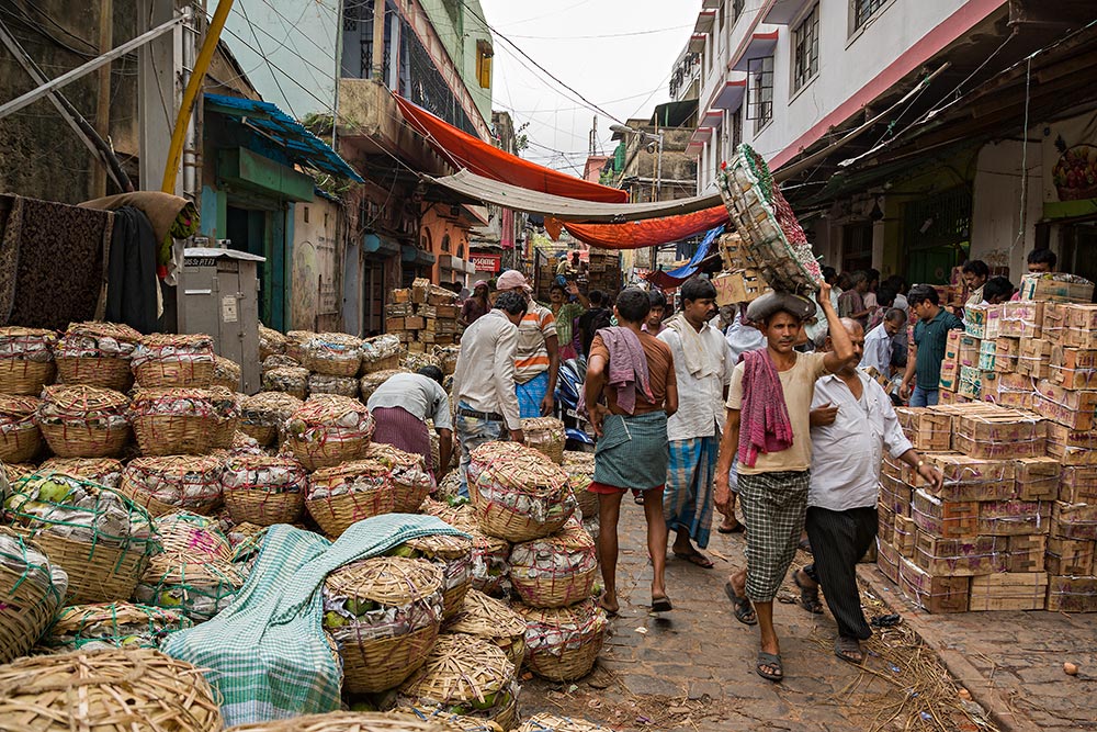 Hard working men at Mechua Market in Kolkata, India.