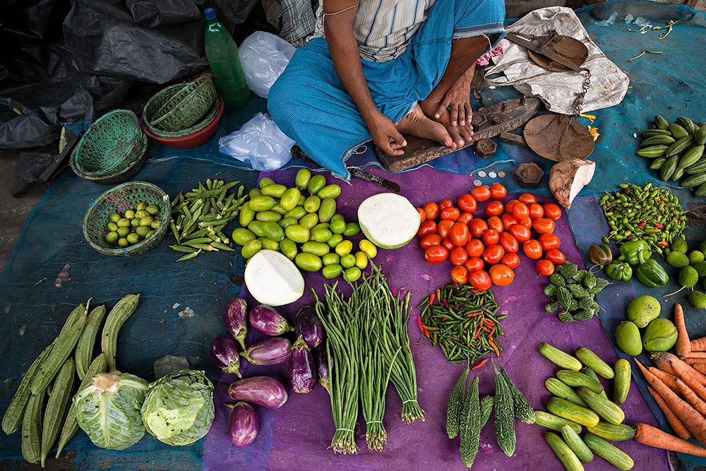 Selling fresh vegetables at Kolay Market in Kolkata, India.