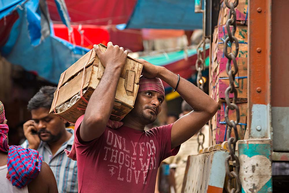 Hard working men at Mechua Market in Kolkata, India.