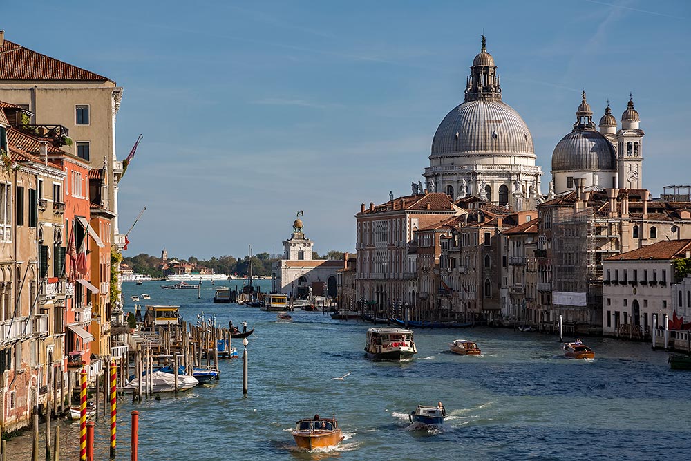 Typical Venice, Italy. The Grand Canal in Venice forms one of the major water-traffic corridors in the city. Public transport is provided by water buses and private water taxis.