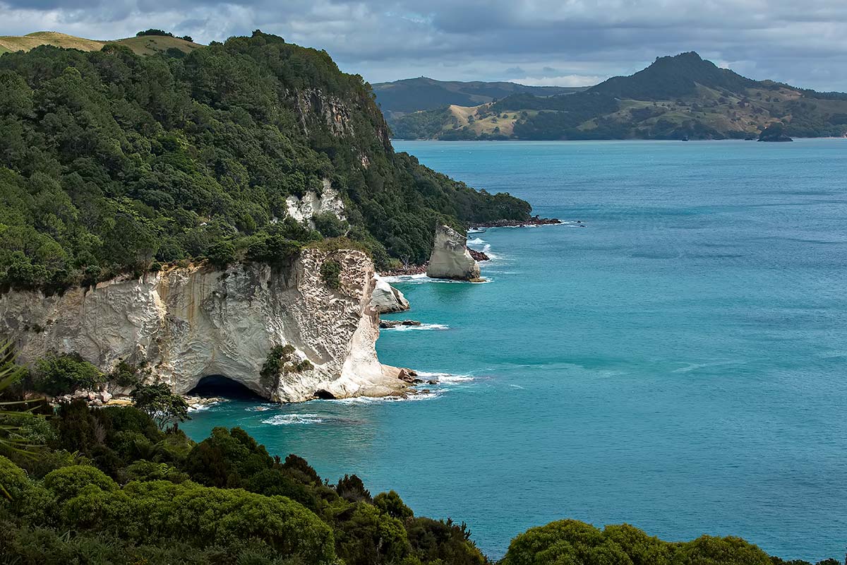 From beautiful Hahei Beach you can walk to Cathedral Cove, where a naturally formed archway deserves photographic attention.