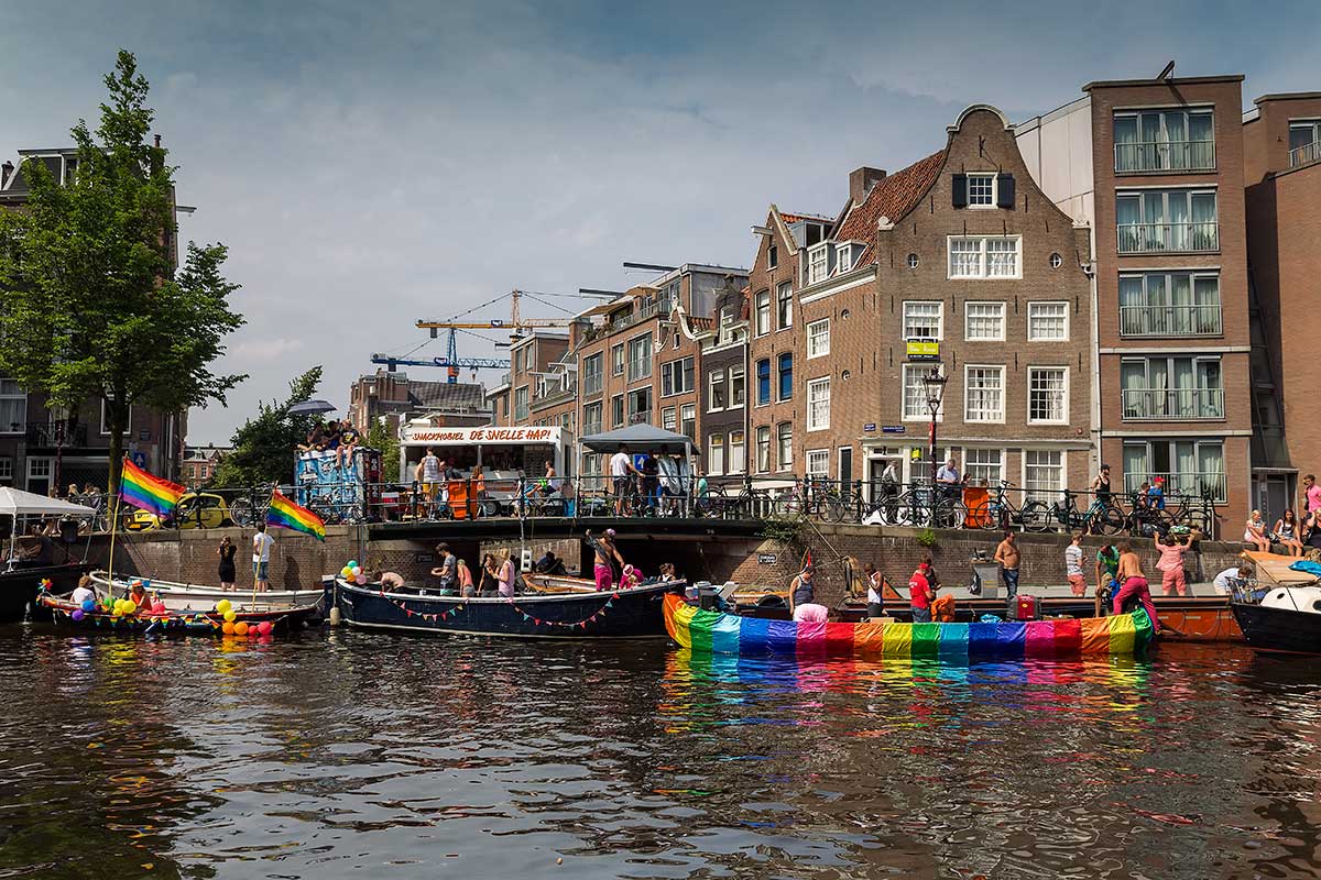 Amsterdammers decorate their own boats along the Gracht to celebrate the Amsterdam Pride Parade.