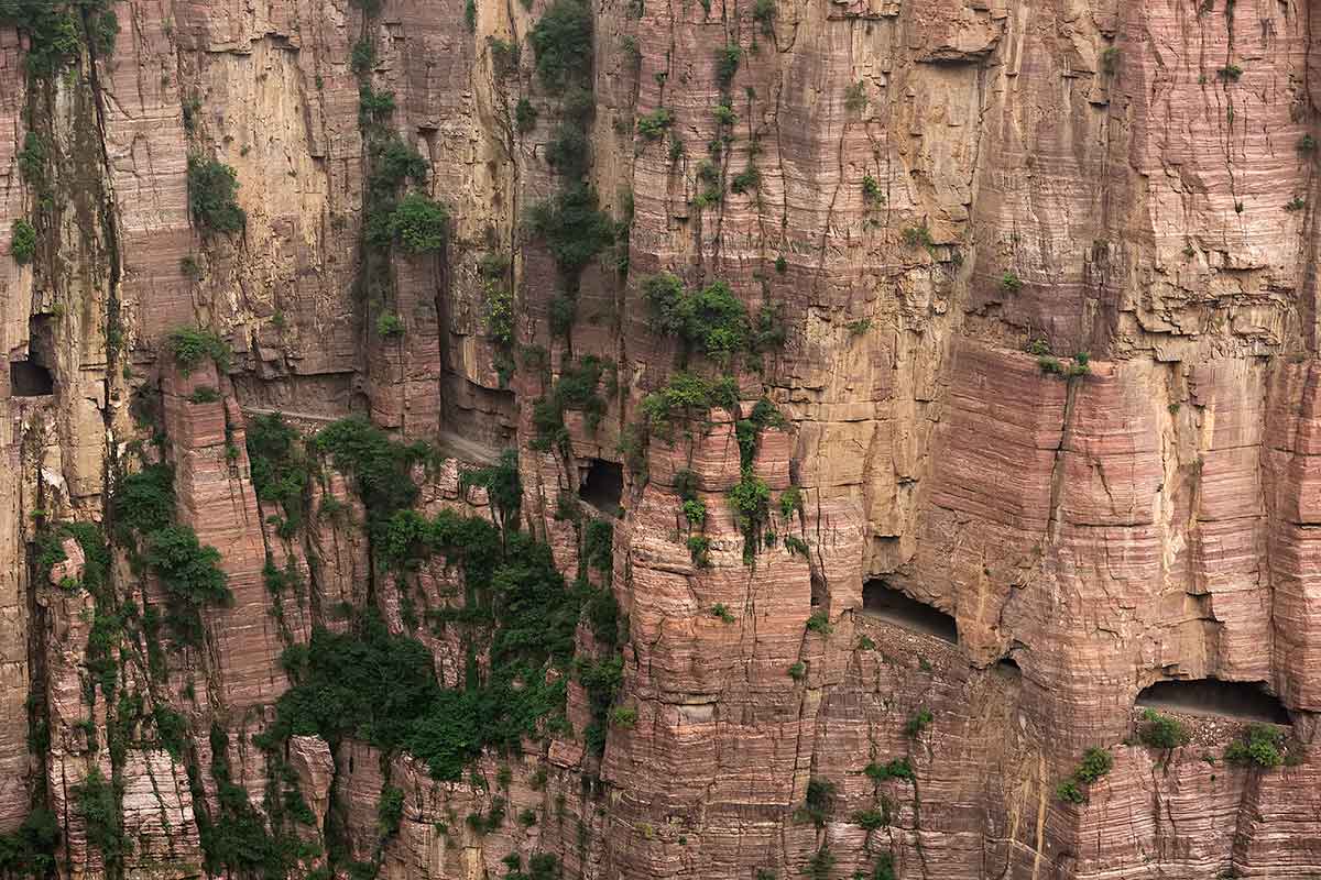 Guoliang Tunnel Road | This is a real man-made wonder; it took 15 years and lots of energy to carve this road up the mountains to get an easier access to the village of Guoliang.