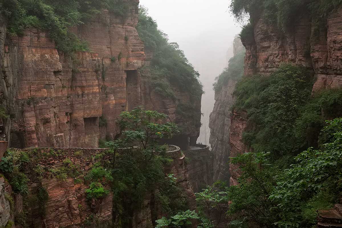 Guoliang Tunnel Road | One can feel the energy that these villagers needed to built this road. There are a few examples of these carved mountain roads in the area and we were speechless by this fascinating achievement. Guoliang Tunnel Road | One can feel the energy that these villagers needed to built this road. There are a few examples of these carved mountain roads in the area and we were speechless by this fascinating achievement.