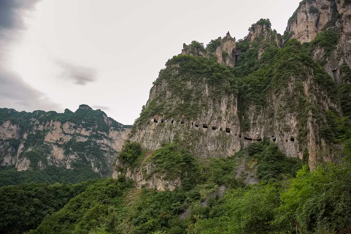 Guoliang Tunnel Road | Guoliang is nestled in a valley surrounded by great mountains, so the village was cut off from outside civilization until the tunnel was built. Guoliang Tunnel Road | Guoliang is nestled in a valley surrounded by great mountains, so the village was cut off from outside civilization until the tunnel was built.