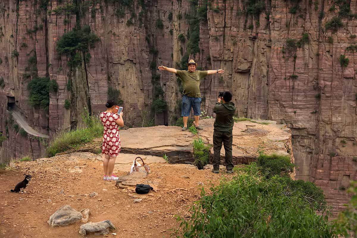 Guoliang Tunnel Road | Tourists love the thrill of standing close to the edge...