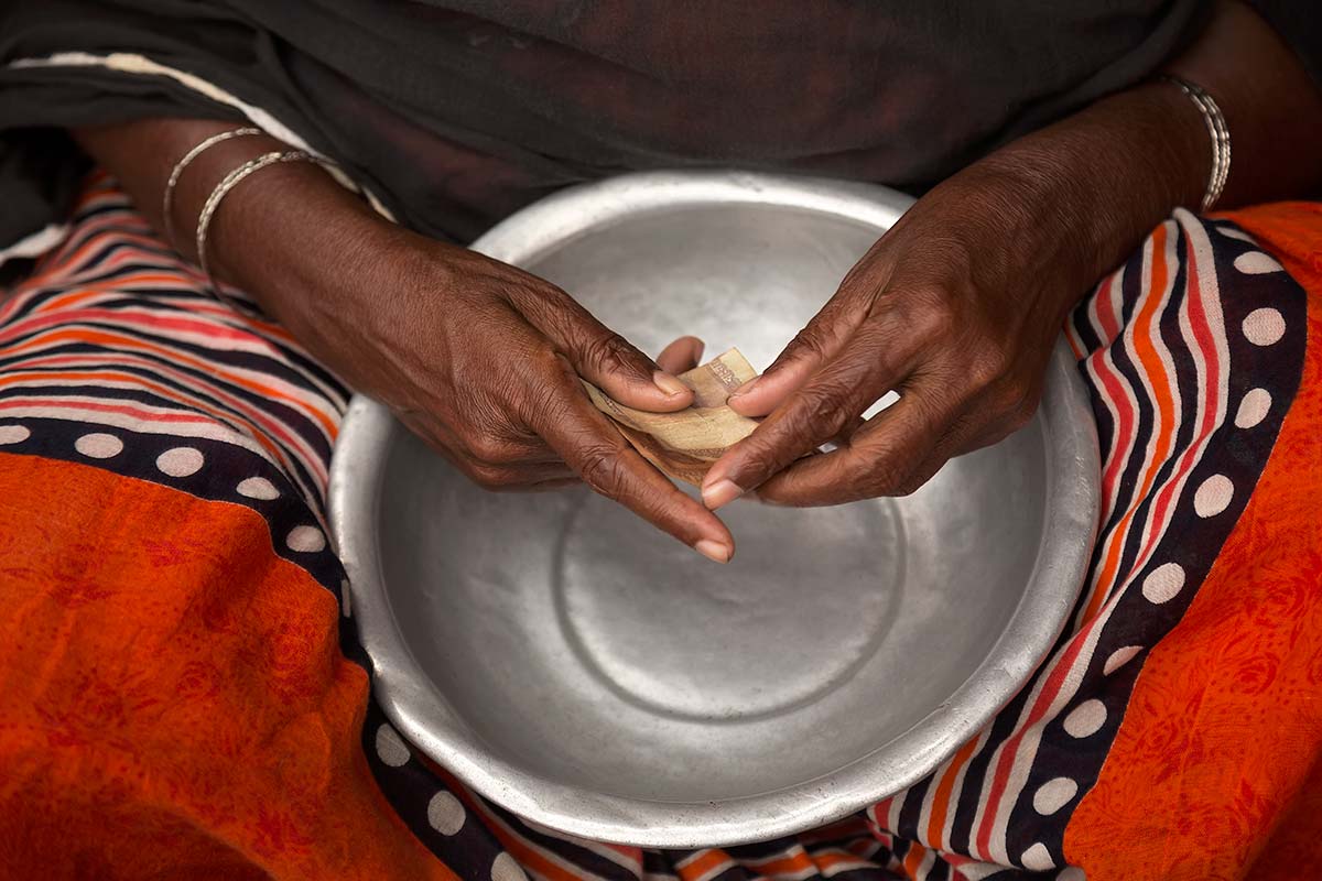 Our human hands are unique. Only we can grasp, hold, move, and manipulate objects with them. Hands are essential for any kind of work. Here you can see the hands of a blind woman begging in the streets of Dhaka. It almost feels like she knows how much money has just been given her...