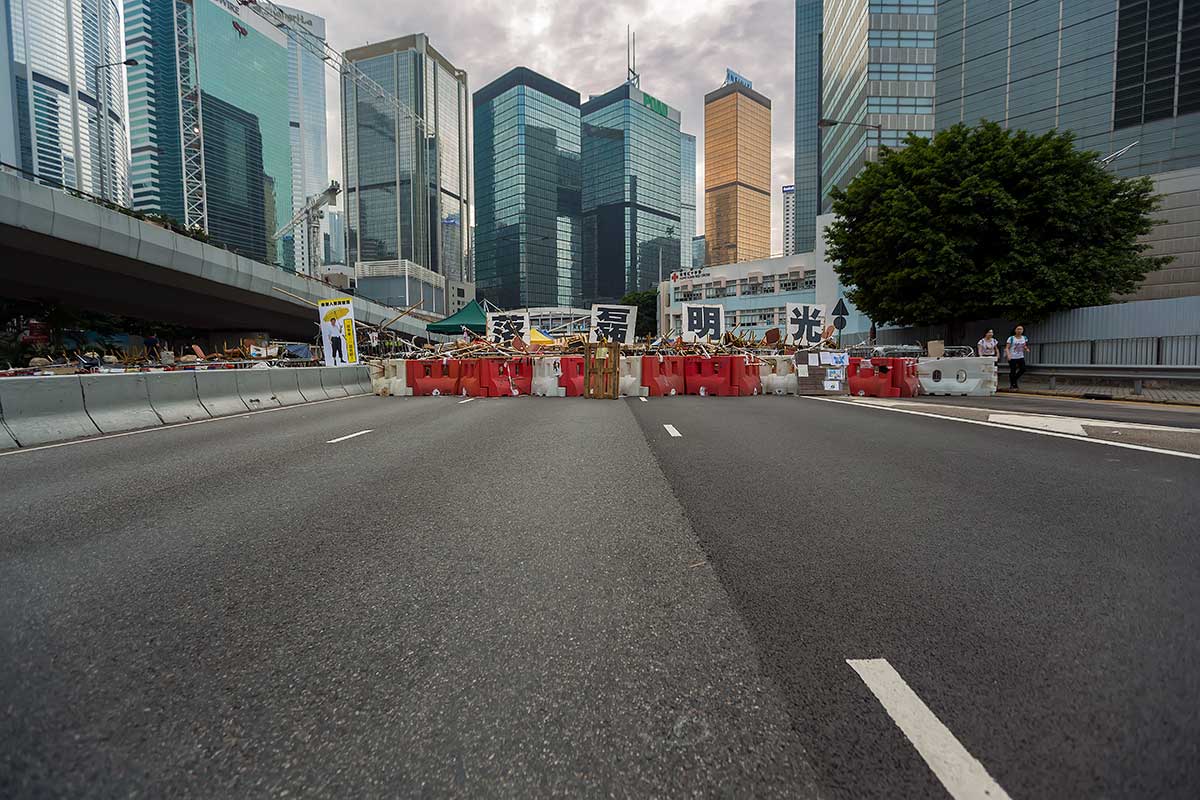 A four character sign saying "In the light of honesty" becomes part of a barricade in Admiralty, Hong Kong..