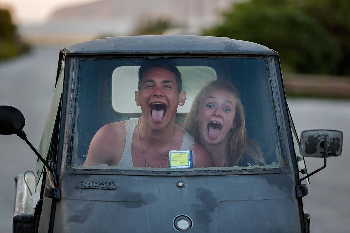 friends-having-fun-piaggio-island-favignana-sicily-italy Even though life on the island of Favignana, the younger generation knows how to have fun - here in a cute little Piaggio.